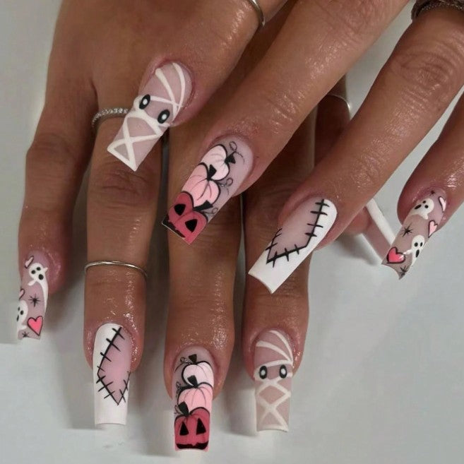 Women's Halloween press-on nail art kit featuring spooky ghost & pumpkin designs for a festive manicure.