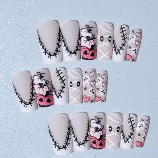 Vibrant orange Halloween press-on nails with cute ghost & pumpkin designs, perfect for costume parties.