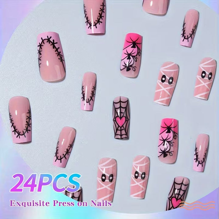 Spooky black Halloween art press-on nails featuring eerie patterns, perfect fake nails for a gothic costume.