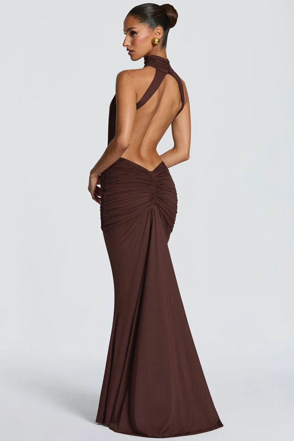 Stunning coffee halter neck backless ruched maxi dress for women, ideal as a formal guest dress.