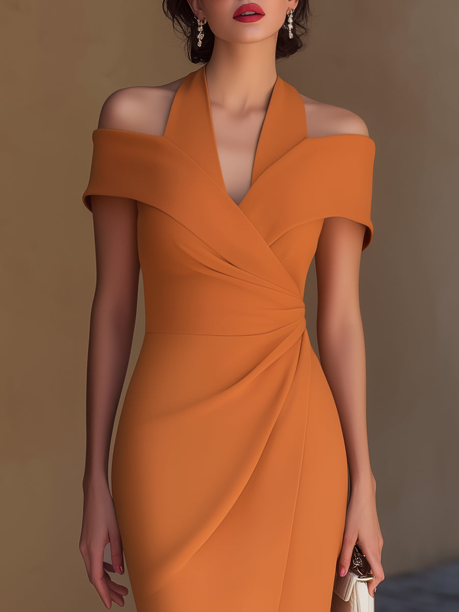 Trendy orange bodycon midi dress with a halter neck, ruched accent & chic wrap silhouette.