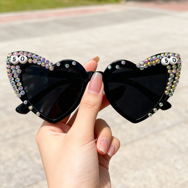 Women's heart rhinestone sunglasses, glamorous UV protection eyewear with sparkling gems for a trendy look.