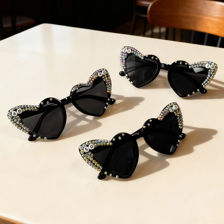 Glamorous women's heart rhinestone sunglasses, providing fashionable UV protection, perfect trendy accessory.