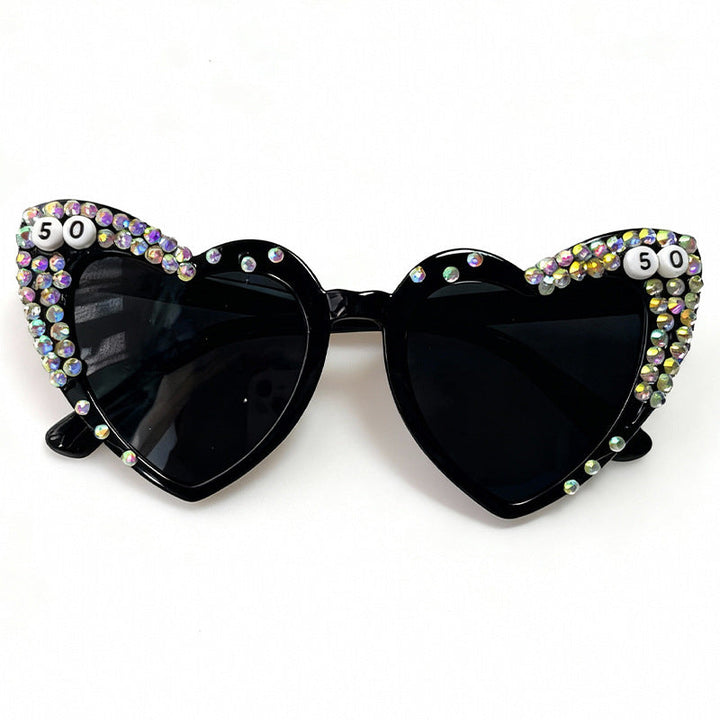 Fashionable women's heart rhinestone sunglasses, a sparkly UV protection accessory for a trendy eyewear statement.