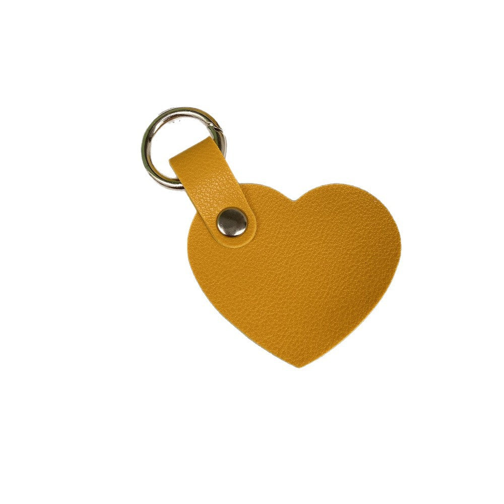 Women's heart leather keychain, practical & fashionable key accessory.