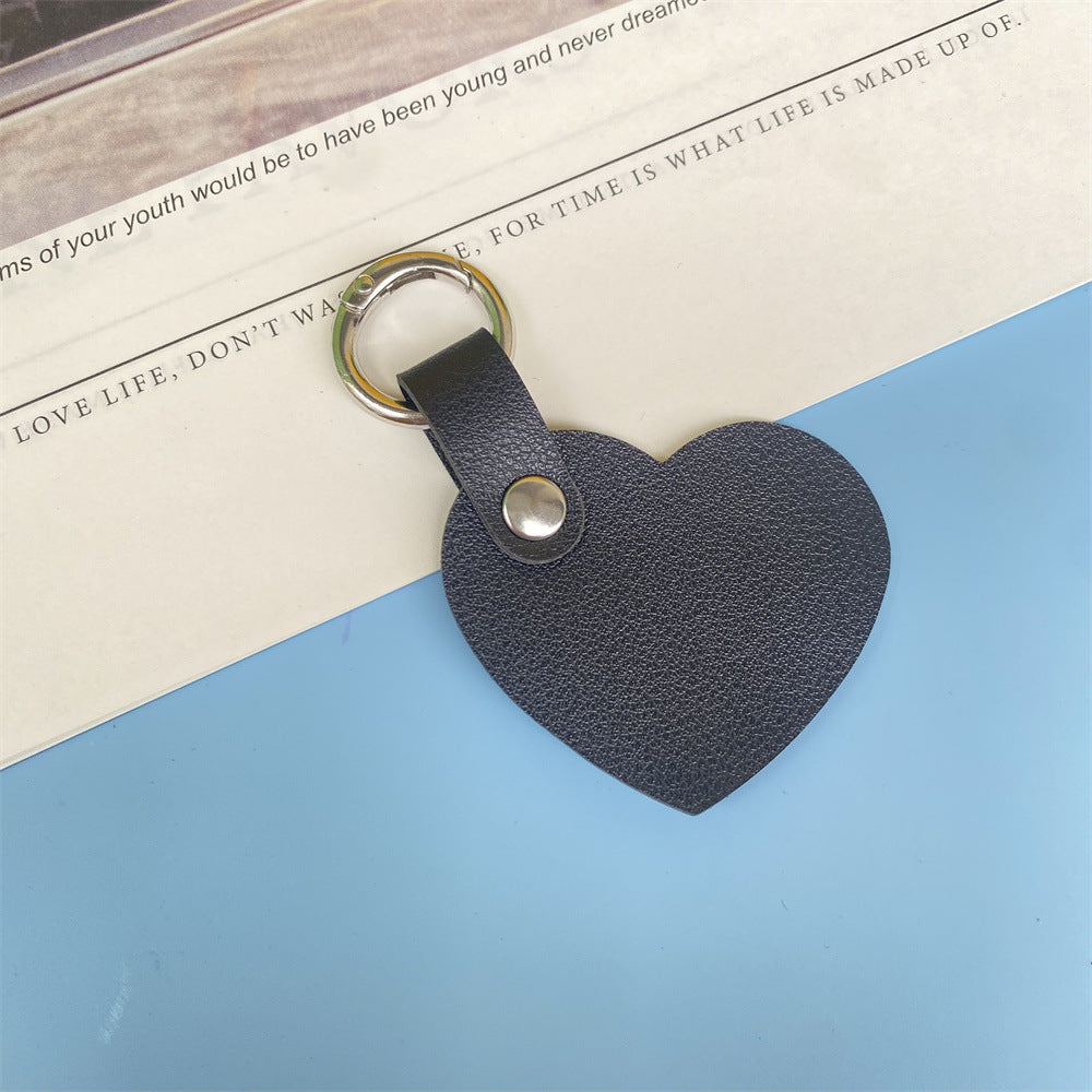 Elegant heart-shaped leather keychain for women, a timeless key accessory.