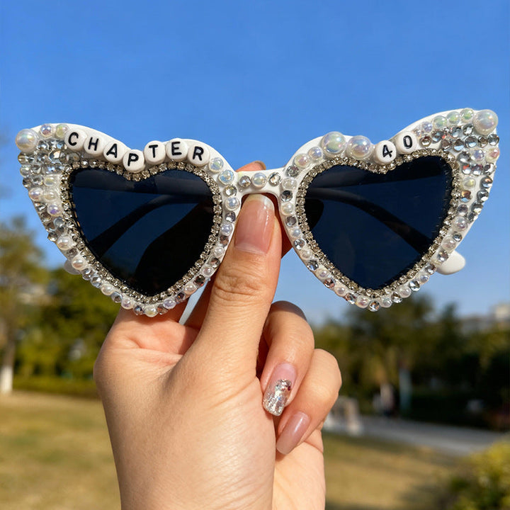Women's designer heart sunglasses, elegant pearls & rhinestones, essential UV protection eyewear.
