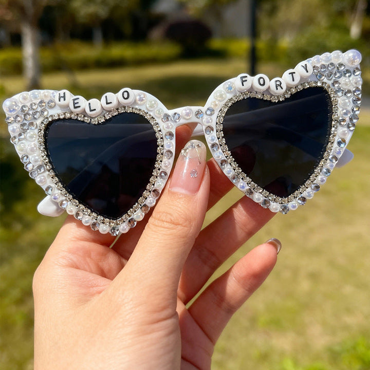 Heart-shaped pearl sunglasses for women, a trendy eyewear accessory with excellent UV protection.