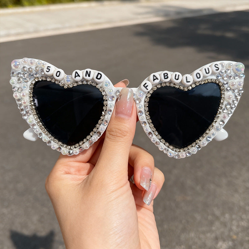 Feminine women's heart sunglasses, adorned with pearls & UV protective lenses. Fashion statement.