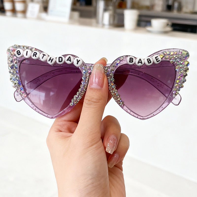 Women's heart-shaped statement sunglasses, a stylish fashion accessory with UV protection.