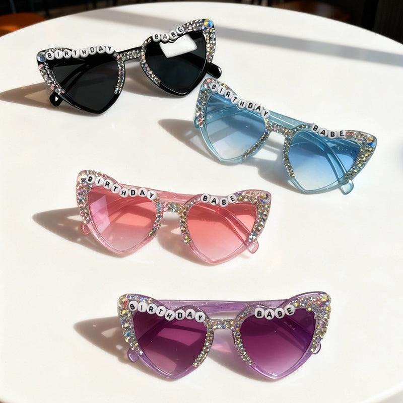 Purple heart-shaped sunglasses for women, a unique and trendy fashion statement with UV protection.
