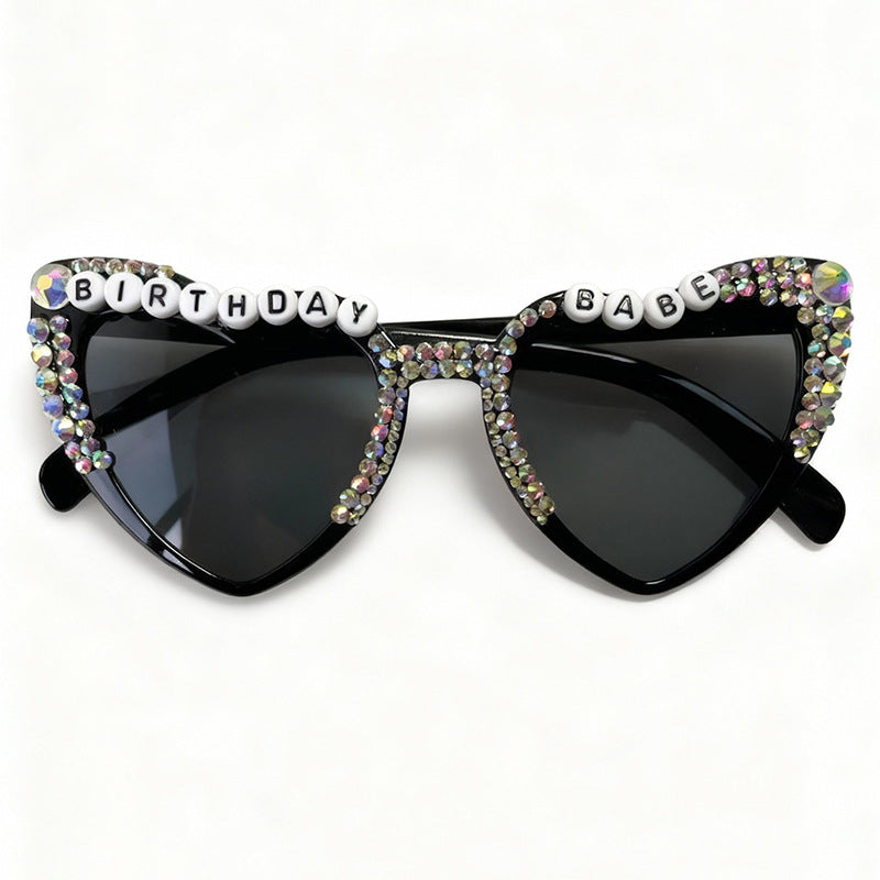 Black heart sunglasses for women, chic statement eyewear providing stylish UV protection.