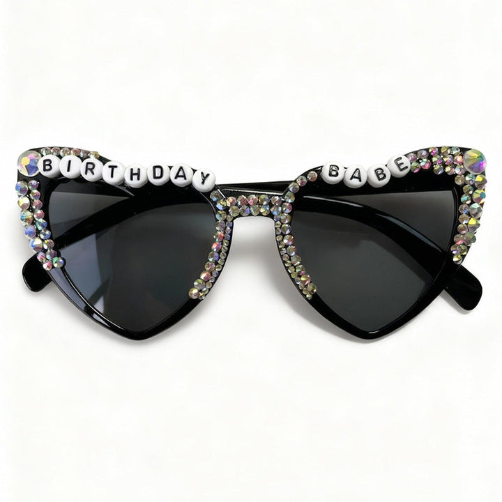 Black heart sunglasses for women, chic statement eyewear providing stylish UV protection.
