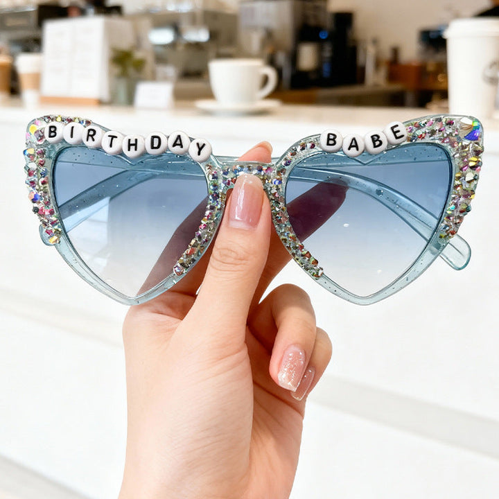 Eye-catching heart-shaped sunglasses, a stylish women's fashion accessory for sun protection.