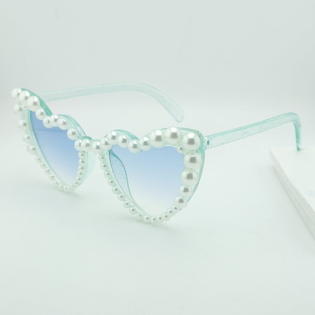 Women's stylish heart-shaped sunglasses with faux pearls, gradient lenses. Perfect unique summer accessory.