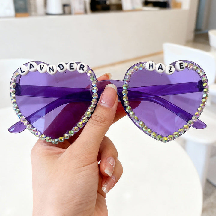 Premium women's heart-shaped rhinestone sunglasses. Glamorous, trendy fashion, UV eye protection.
