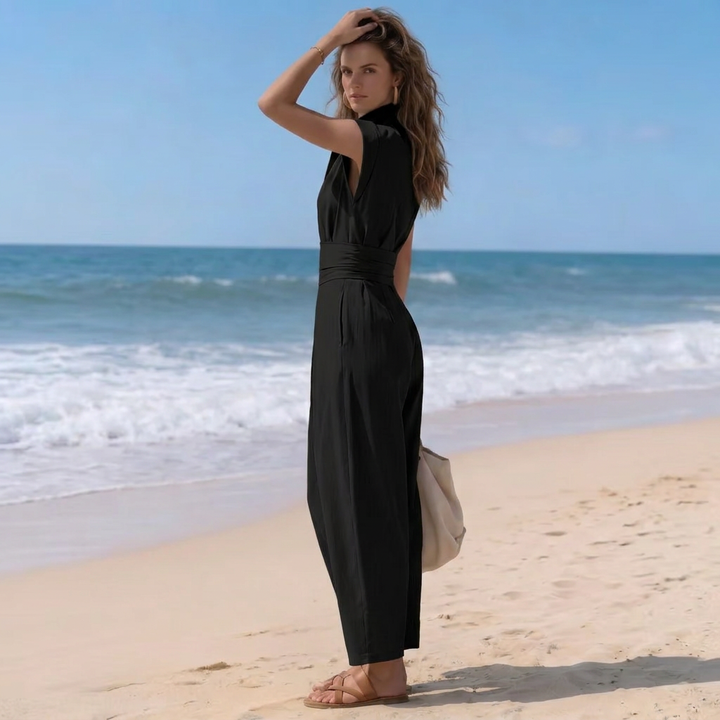 Elegant women's harem jumpsuit, high-neck, cap-sleeve, and ruched waist for comfortable, versatile fashion.