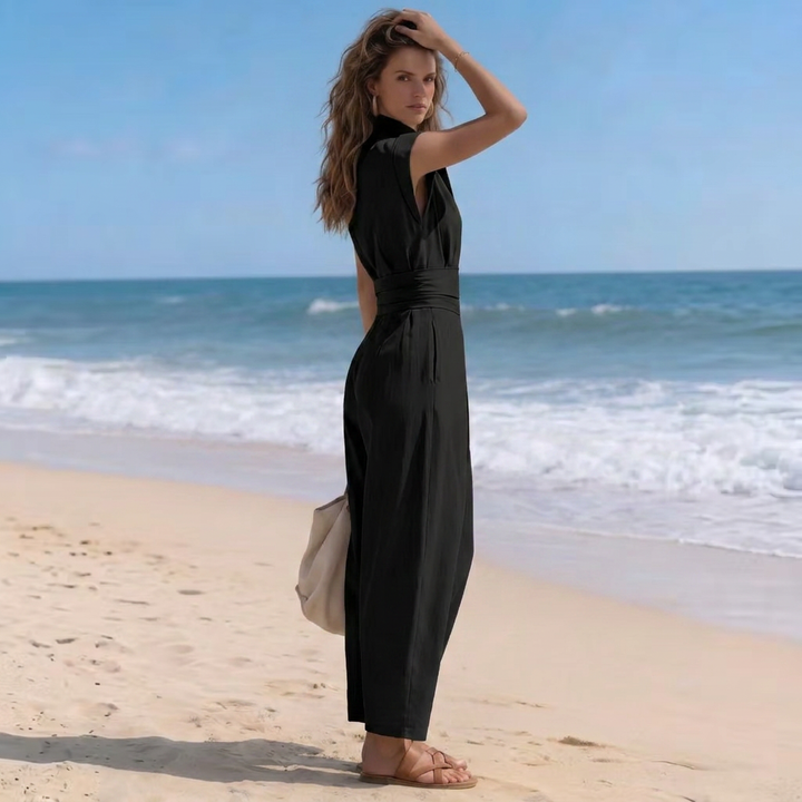 Chic women's one-piece harem jumpsuit with high-neck, cap-sleeve, and ruched waist for casual or dressy looks.