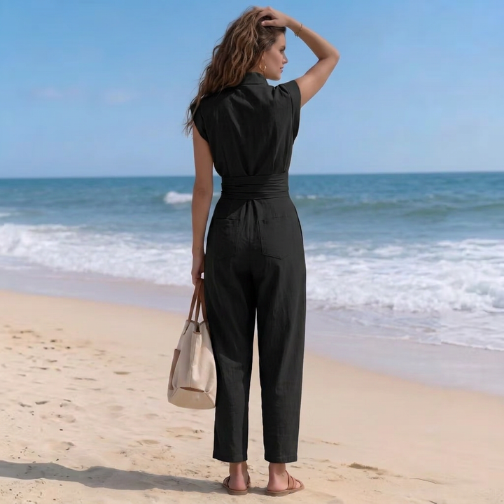 Flattering women's high-neck cap-sleeve jumpsuit. Harem pants & ruched waist create a stylish, comfortable silhouette.