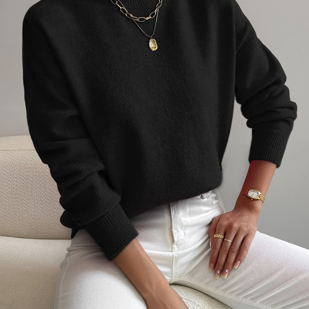Elegant women's knitted high neck sweater. Perfect for stylish autumn & winter layering.