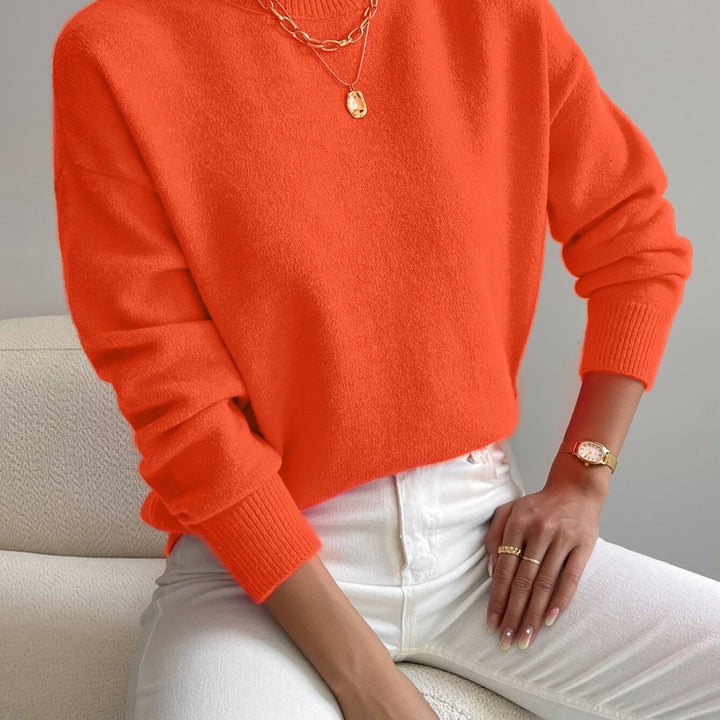Women's soft knit high neck jumper, offering warmth and style for autumn winter.