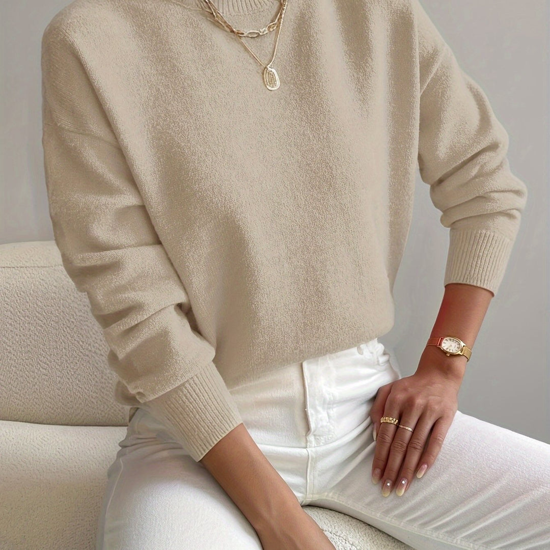 Warm autumn winter women's high neck knit. A versatile long-sleeve pullover for comfort.