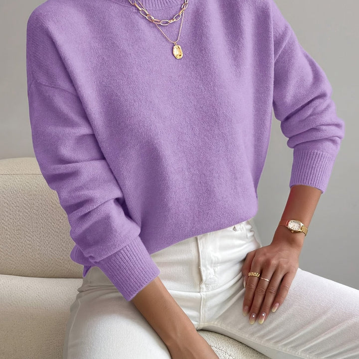 Ladies' high neck long sleeve knit pullover. Perfect for a cozy yet elegant autumn look.