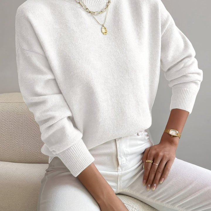 Women's high neck knitted sweater for winter. Soft and warm, ideal for comfort & style.
