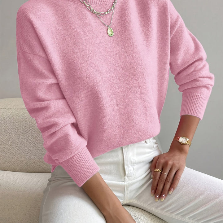 Essential high neck women's knit jumper. Long sleeve, perfect for autumn and winter layering.
