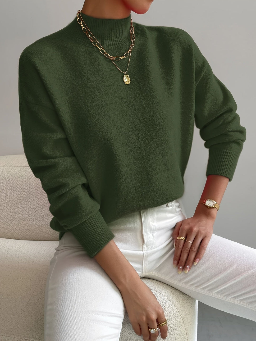 Chic women's high neck knit jumper. Warm and cozy pullover for cold weather style.