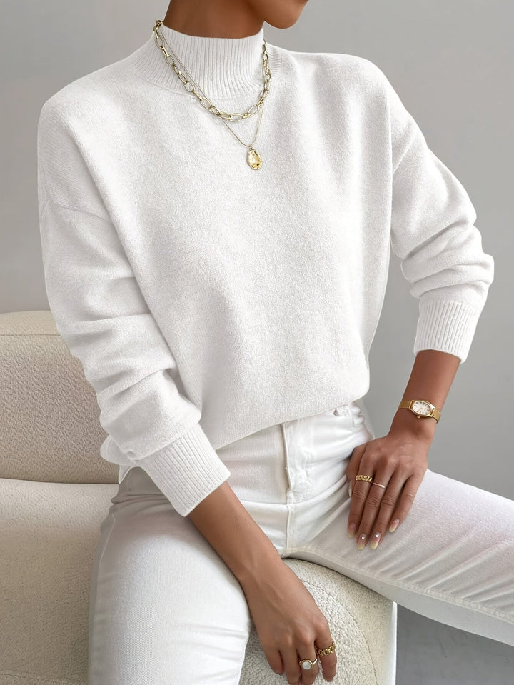 Versatile ladies' knitted high neck pullover. Elegant casual wear for chilly days.