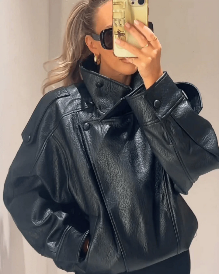 Polished women's leather moto jacket, high neck design, structured for chic everyday fashion.