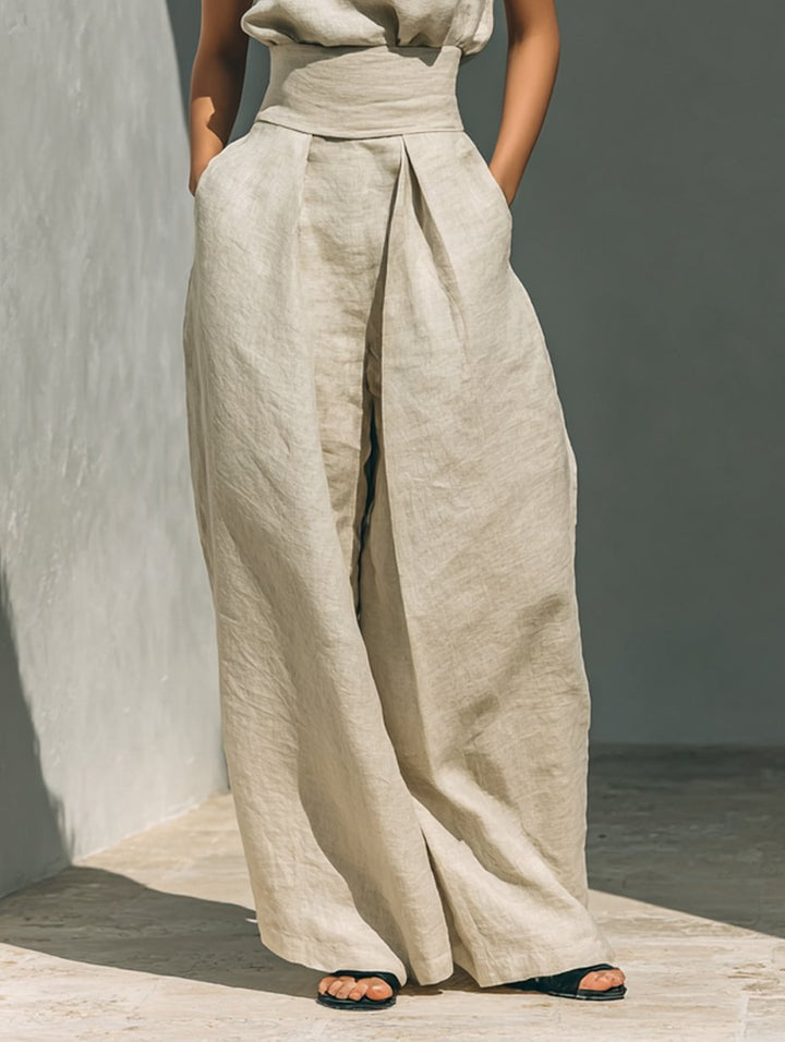 Chic women's high-neck sleeveless blouse & wide-leg pants two-piece set. A modern minimalist summer outfit.