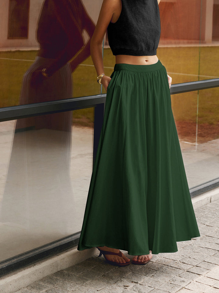 Casual green A-line maxi skirt for women, high-waisted for comfortable, flowy summer vacation outfits.