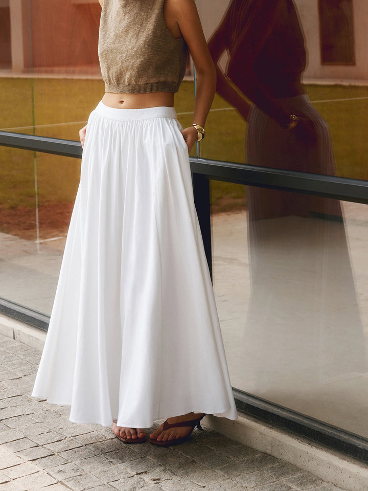 White high-waist A-line maxi skirt, ideal for a chic summer vacation outfit or casual, versatile style.