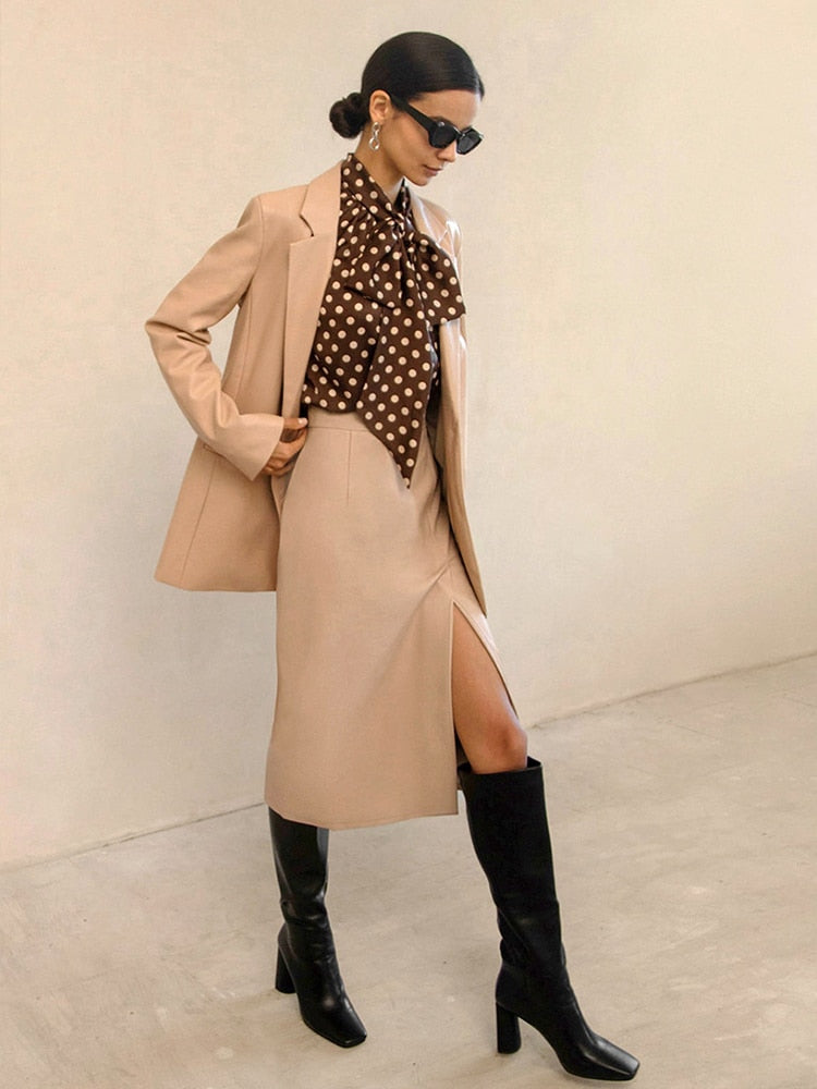 Versatile women's high-waist bodycon midi skirt with side slit, ideal for smart casual or professional wear.