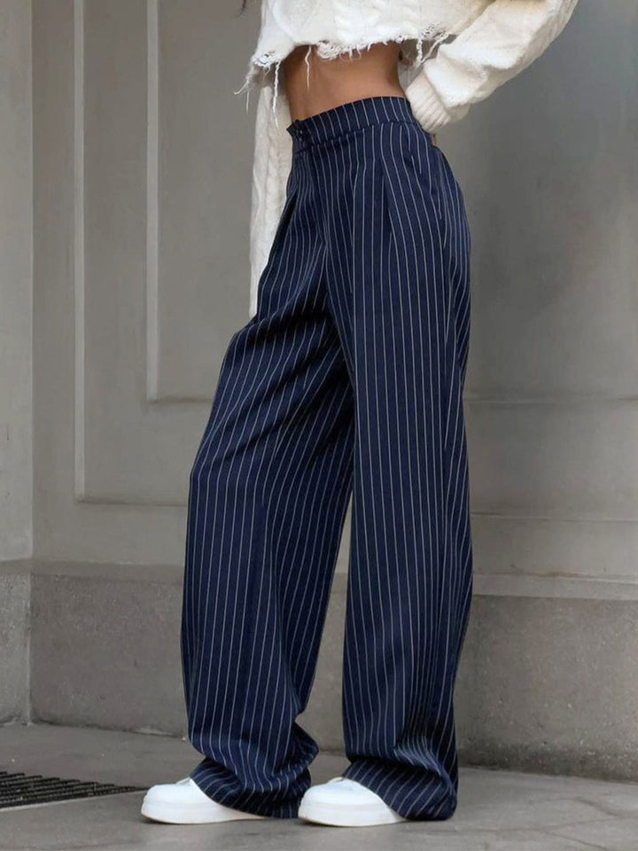 Stylish women's pinstripe wide leg trousers with a flattering high waist, ideal for fashion-forward bottoms.