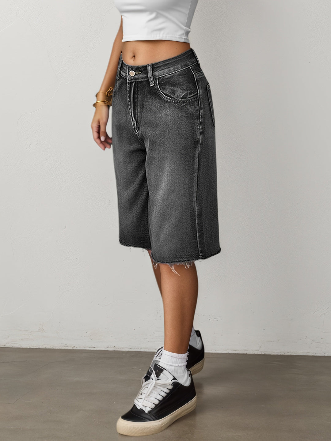 Model wearing women's relaxed fit high waist jorts, wide leg, knee length, in a summer outfit.