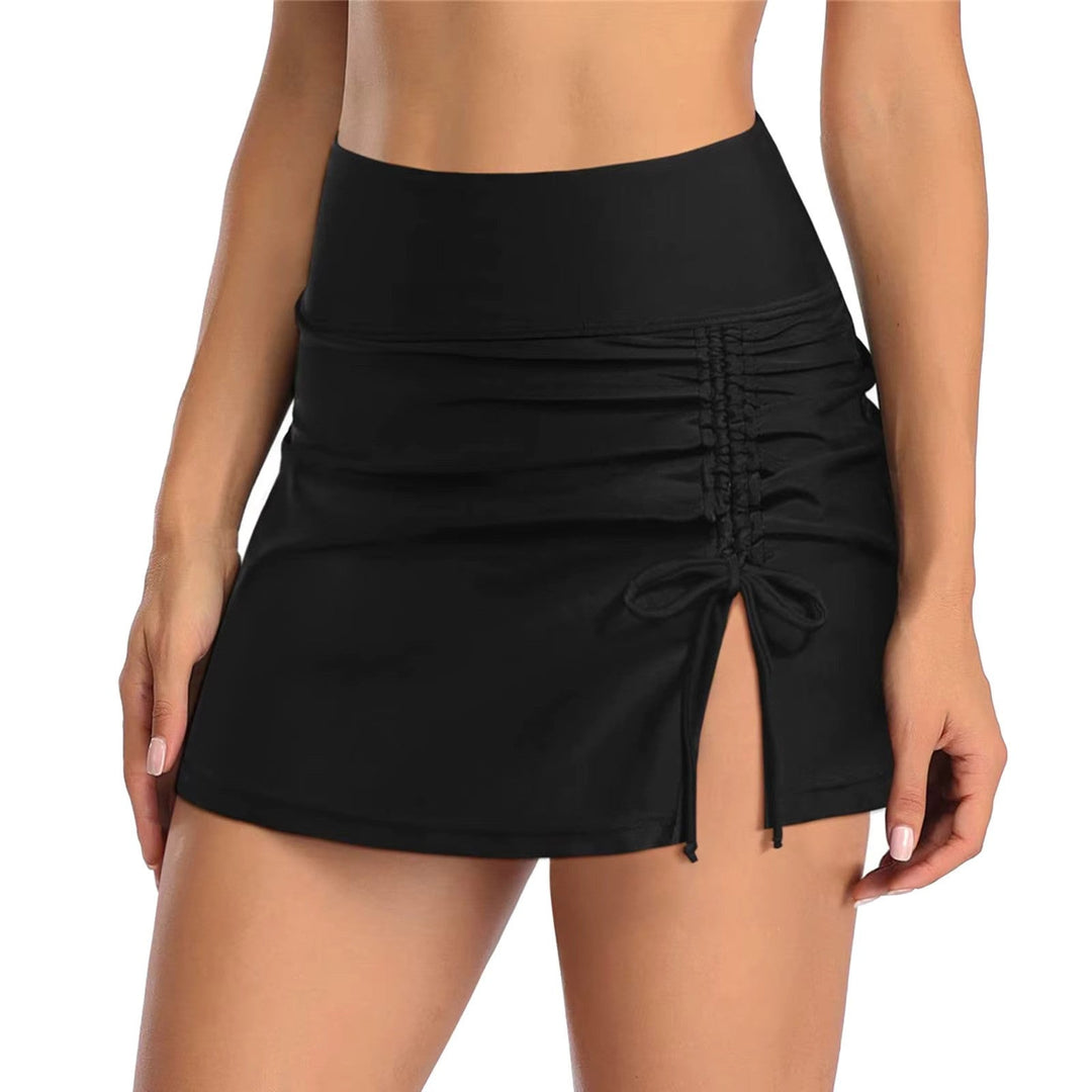 Stylish women's swim skirt featuring a flattering high waist & adjustable ruching, ideal as a swim cover-up.