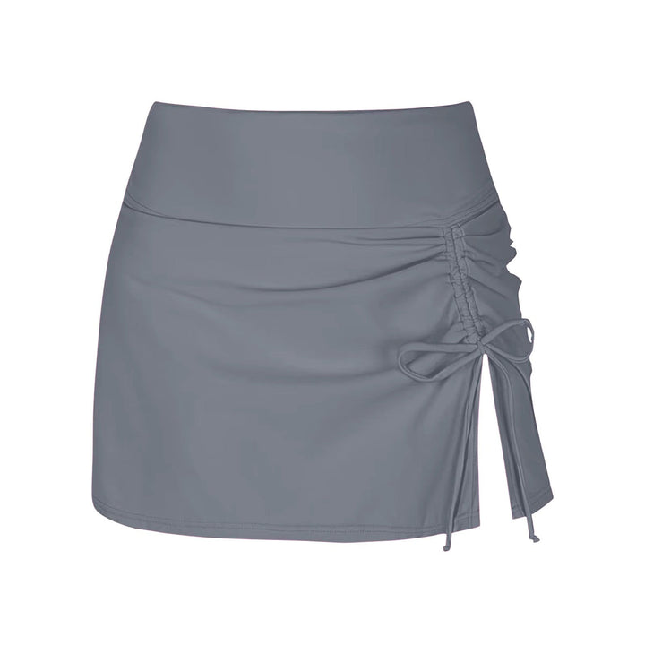 Detailed close-up of the ruched fabric on the high-waist women's swim skirt, highlighting texture.