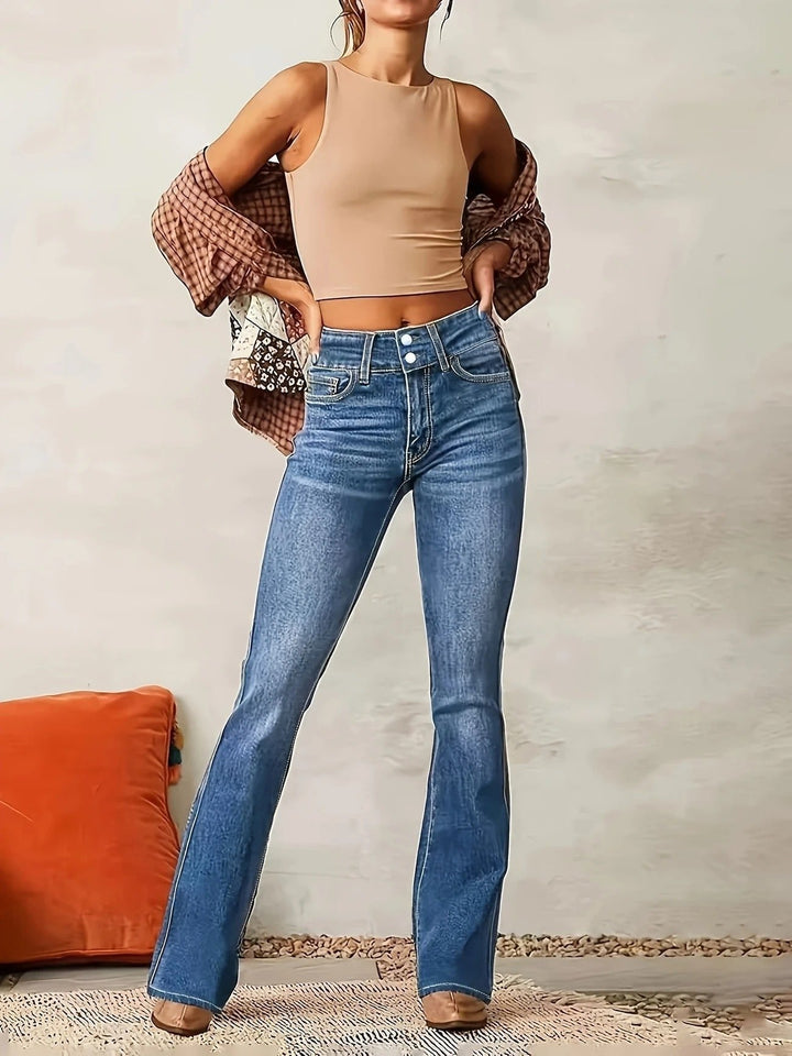Women's sculpted high-waist flare jeans. Medium wash blue denim, designed for a comfortable & elegant fit.