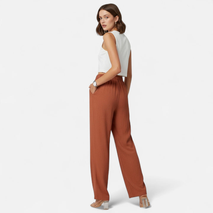 Elegant women's straight-leg trousers with a flattering high-waist, ideal for professional office wear.