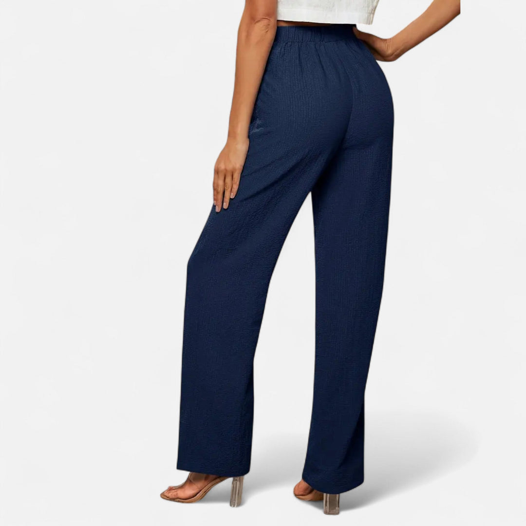 Timeless women's high-waist straight-leg pants, perfect for creating sophisticated formal or relaxed casual looks.