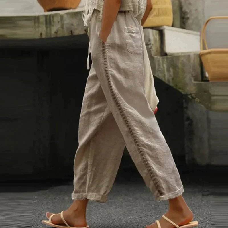 Comfortable high-waist women's tapered trousers with elegant side buttons, a versatile and stylish bottom.