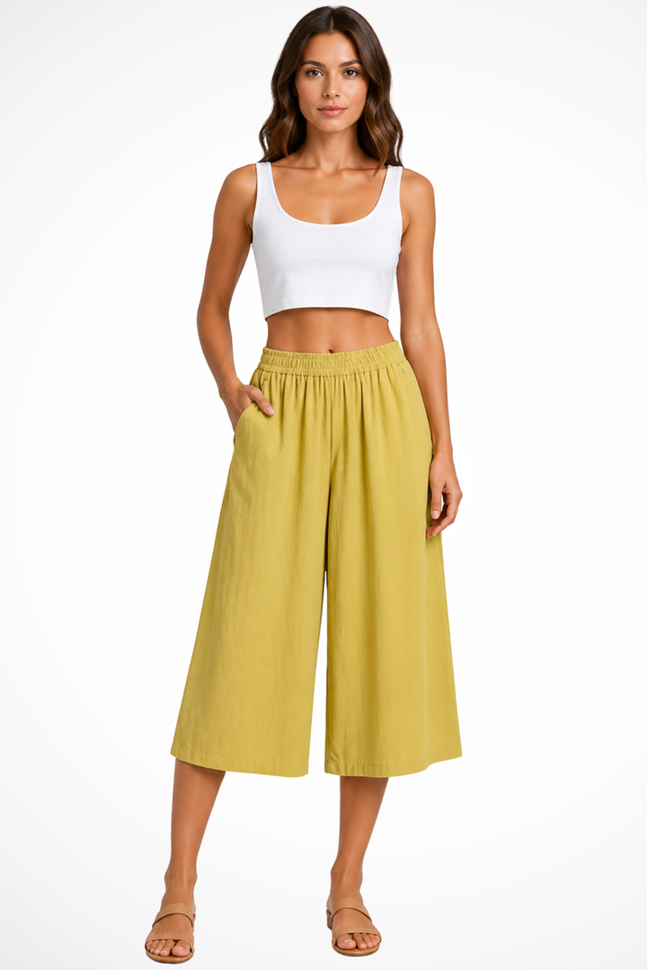 Cropped wide leg trousers for women, high waist fit, elasticated comfort, practical pockets. Ideal for summer casual style.