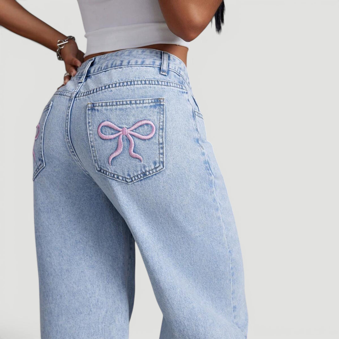 Fashion-forward women's high waist denim, wide leg cut, bow detail.