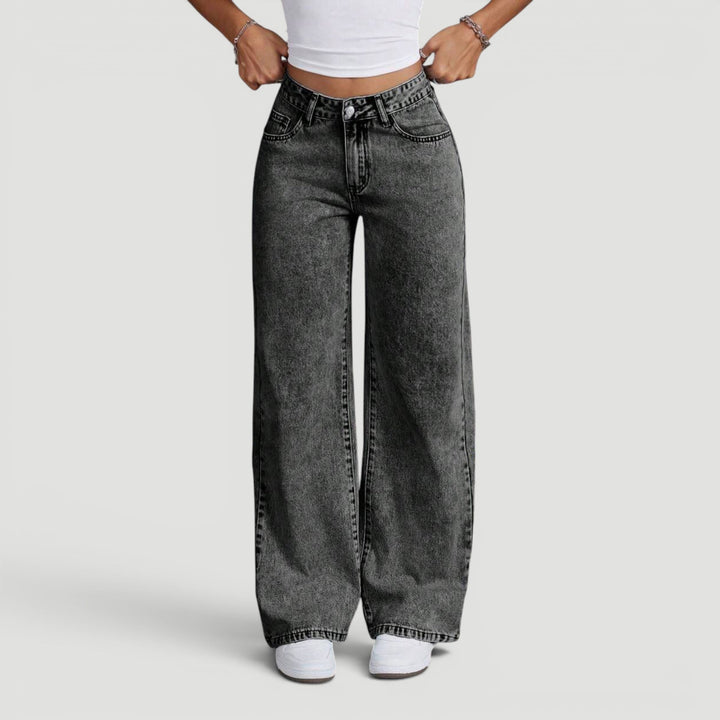 Classic women's high waist wide leg jeans, modern bow embellishment.