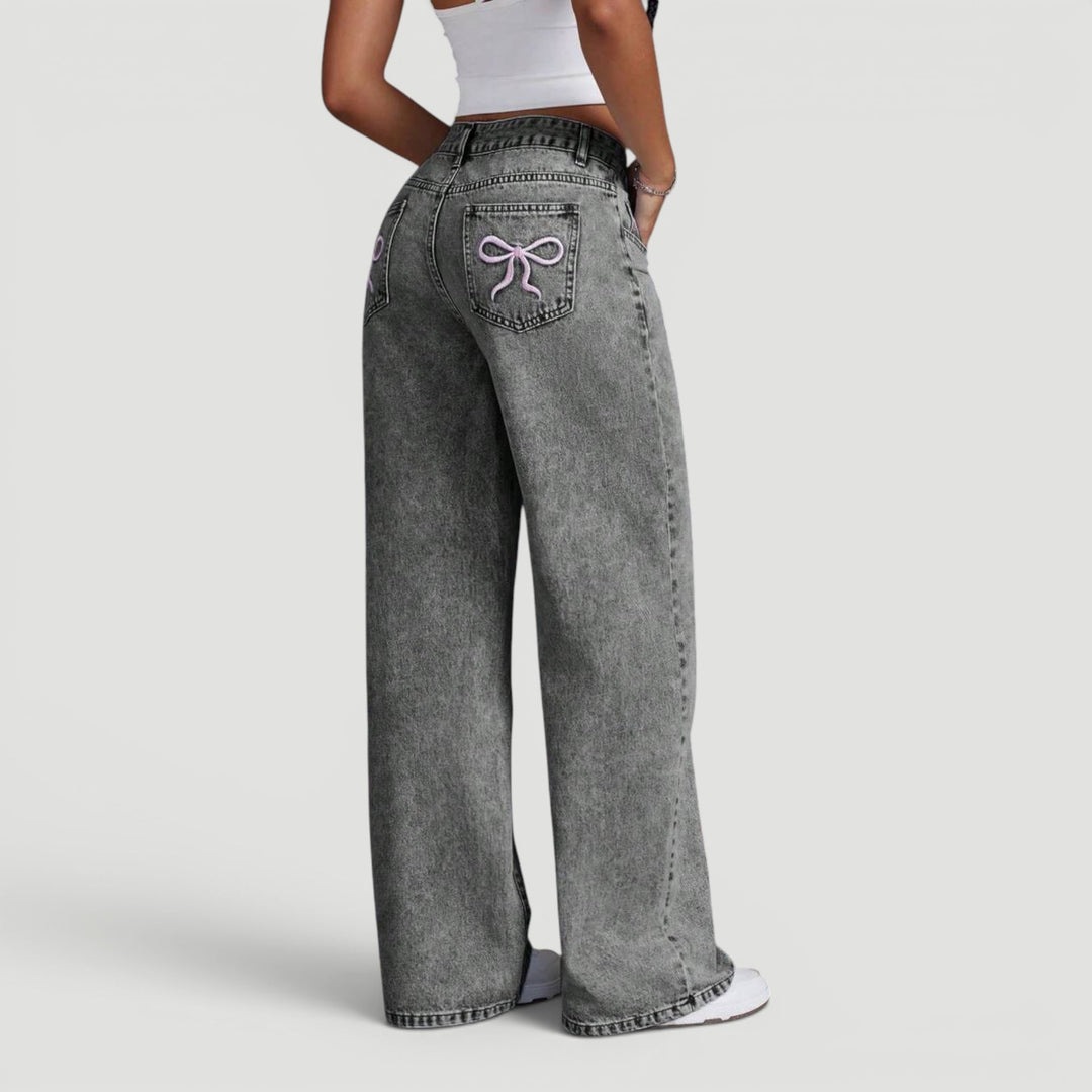 Chic women's denim wide leg pants, high waist fit, elegant bow.