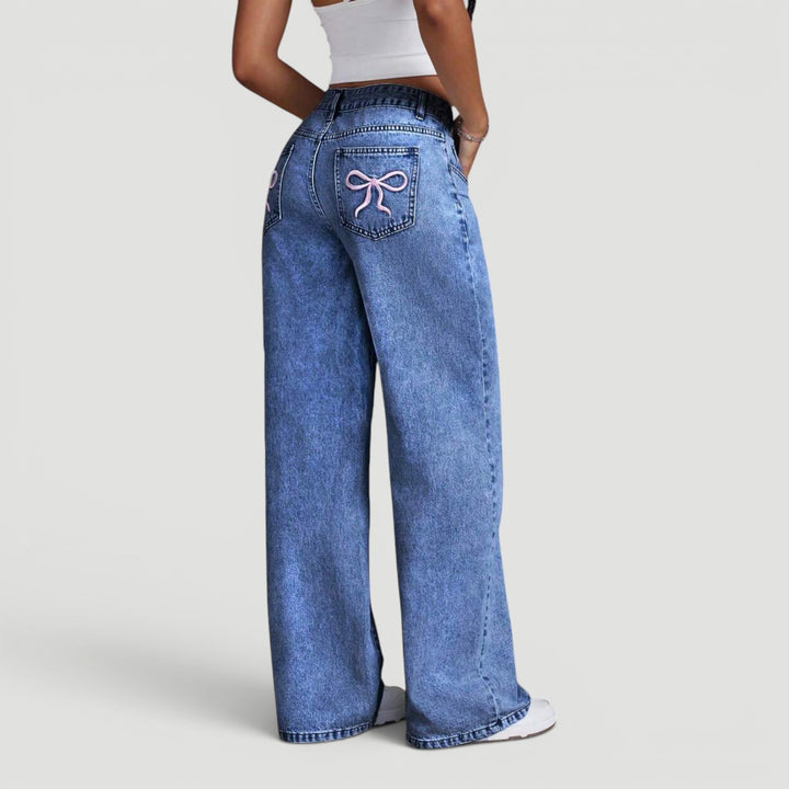 Women's high waist wide leg jeans, comfortable & stylish bow accent.
