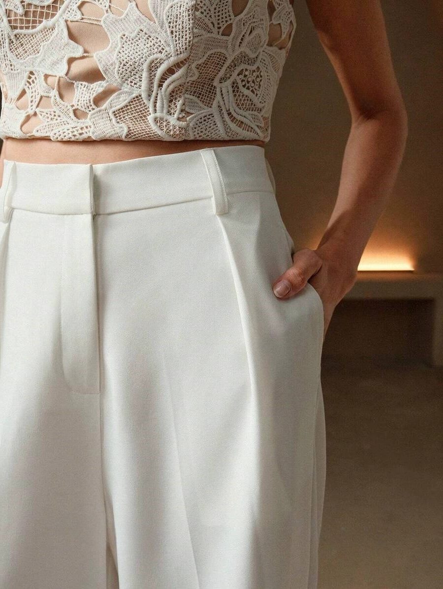 High waist wide leg tailored trousers for women, embodying effortless style and modern elegance.